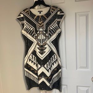 Black and gold sequins dress.